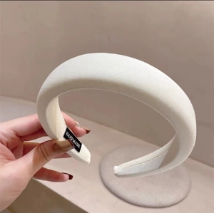Thick white sponge headband with pleated twill fabric and handmade label for women