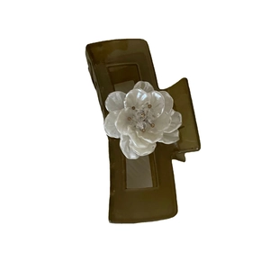 French style hair claw clip featuring an olive green base and white floral decoration