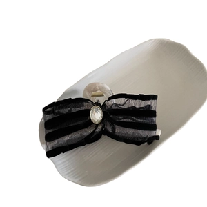 Elegant mesh bow hair claw clip with striped ribbon and large crystal centerpiece