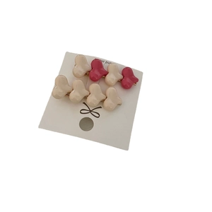 Gradient heart hair clips in macaron colors on white card with golden base