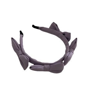 Elegant purple French satin headband featuring four matching macaron bows on a white base