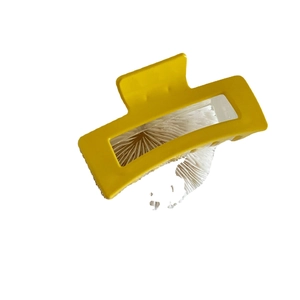 Minimalist matte yellow rectangular hollow hair claw clip for women on white background