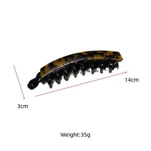 Detailed view of 14cm acetate banana hair clip with tortoiseshell pattern and inner teeth