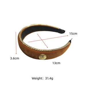 Detail view of burgundy velvet headband with gold braided trim and horse emblem, width 3.6cm