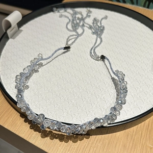 Elegant light blue crystal headband with detachable tassels and woven beaded design