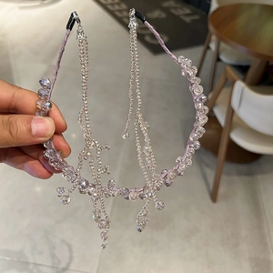 Detailed shot of lavender crystal headband featuring elegant detachable beaded tassels