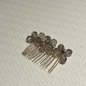 Elegant gold metal hair comb with brown crystal flowers and iridescent AB rhinestones