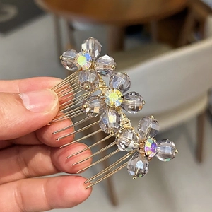 Exquisite crystal hair comb with three smoke gray floral designs on gold metal prongs