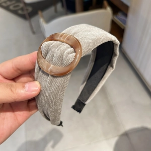 Retro wide suede-style headband in beige with amber resin ring and non-slip inner lining