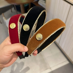 Vintage velvet headbands with golden lion emblems and braided trim in red black and brown