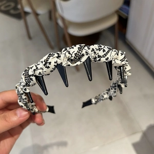 Floral headband with punk style rivets and sequins detail for secure non-slip hair styling