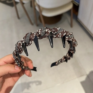 Floral print headband with sparkling rhinestones and black punk spikes detail