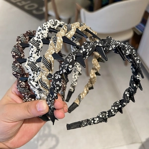 Close-up of floral fabric headbands with non-slip teeth and sparkling rhinestones