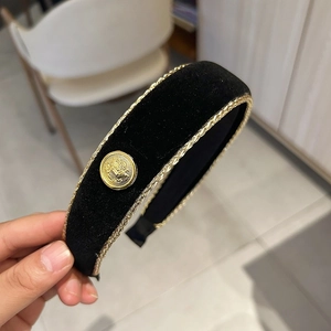 Retro black velvet headband with gold woven trim and metallic buckle ornament for women