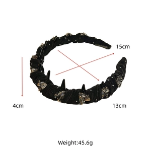 Detail view of black velvet headband with punk spikes, rhinestones, and 4cm width specs