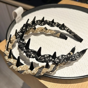 Floral print non-slip headbands with punk spikes and bead details in black and khaki colors