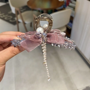Elegant purple ribbon hair claw clip with crystal pearls and hanging bead tassels