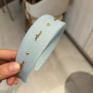 French denim headband in light blue with gold studs and Dream metal lettering decoration