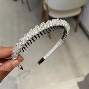 Detail view of silver headband featuring double rows of crystal beads and inner comb teeth