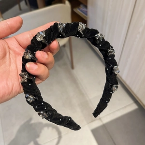 Padded black velvet headband with sparkling crystal rhinestones in elegant retro style