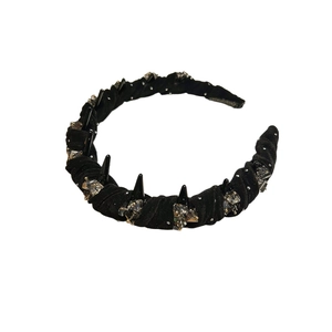 Elegant black satin headband with decorative studs and crystals for a high skull top style