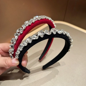 Detail of red and black velvet headbands with sparkling marquise rhinestones