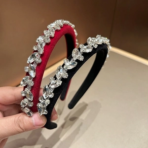 Detail of velvet padded headbands with marquis crystals in burgundy and black