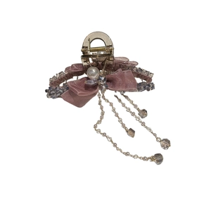 Elegant gold bow hair claw clip with pink mesh, pearls and dangling crystal tassels