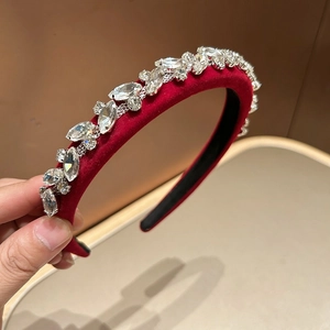 Detail of red velvet headband with sparkling marquise and round cut rhinestones