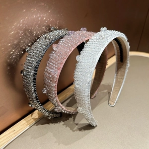 Macro detail of three luxury beaded headbands with crystal rhinestones and non-slip teeth