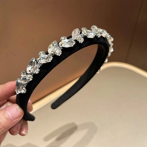 Detailed macro view of the black velvet headband featuring sparkling marquise rhinestones