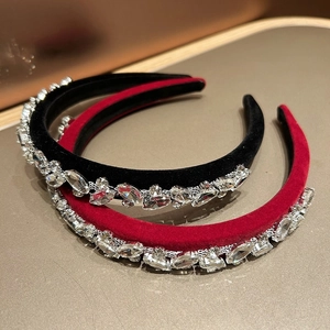 Detail of luxury velvet headbands with sparkling crystal rhinestones in black and red