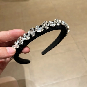 Luxe padded black velvet headband featuring sparkling marquise-cut crystal embellishments