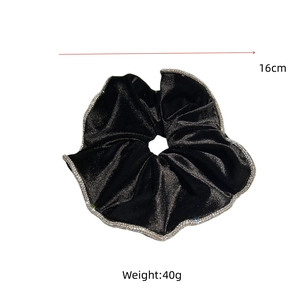 Detail of 16cm black velvet scrunchie with sparkling rhinestone trim and 40g weight