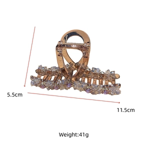 Detail showing crystal hair claw dimensions 11.5cm length with purple gemstones