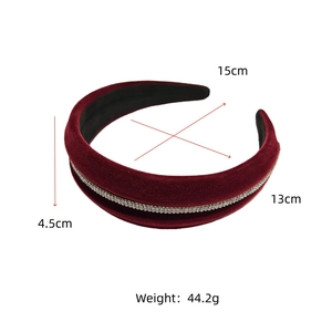 Detail view of burgundy velvet headband showing 15cm width and sparkling rhinestone trim