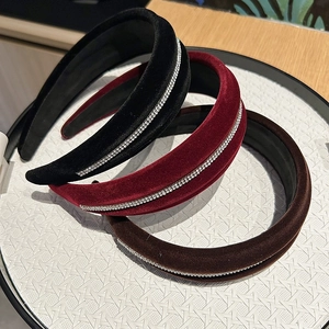 Macro detail of luxury velvet padded headbands with sparkling rhinestone embellishments