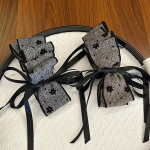 Elegant set of two French-style bow hair clips with plaid fabric and long black ribbons