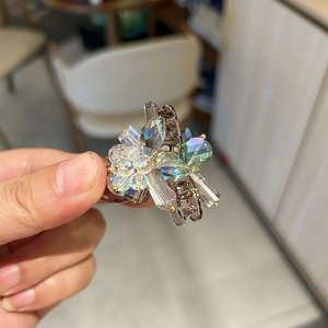 Luxury mini hair claw clip featuring elegant blue-purple gradient crystals and floral design
