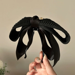 Vintage black knitted bow banana clip for high ponytail, featuring a gold metal buckle detail