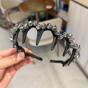 Detail of a black non-slip headband featuring densely inlaid faceted crystal beads for women