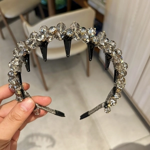 Detail of luxury rhinestone headband with grey crystal beads and chic punk metallic elements