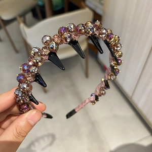 Detailed macro of crystal beads and pink silk fabric on this luxury wavy headband