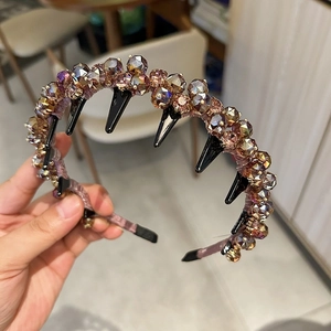 Detail of luxury rhinestone headband with purple velvet wrap and anti-slip inner teeth