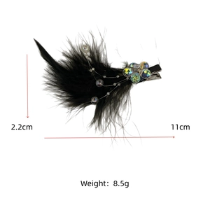Detail view of black feather hair clip with crystal beads measuring 11cm by 2.2cm
