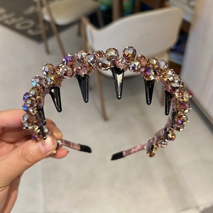 Detailed view of light purple rhinestone wavy headband with non-slip teeth for women