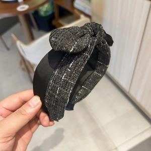 Elegant black tweed knotted headband with silver threads for women’s hair styling