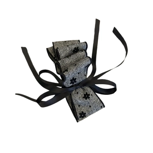 Elegant multi-layered bow hair clip in black and white mesh fabric with floral embroidery