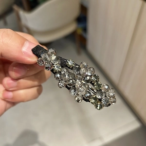 Elegante fermaglio per capelli con perline di cristallo grigio su base di stoffa