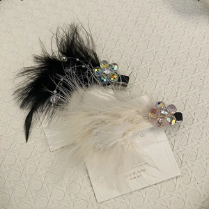 Detail of fairy feather hair clips with rainbow crystal flowers and small pearls